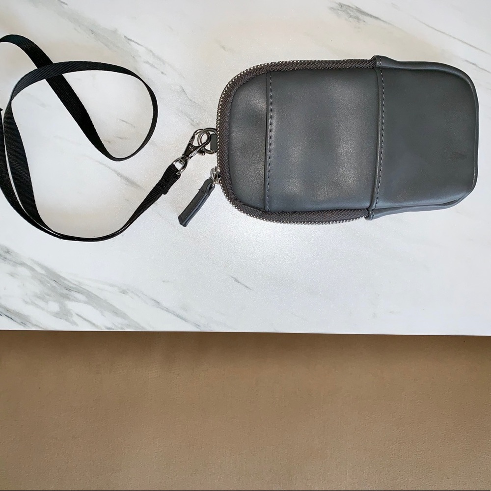 Mini travel bag with neck strap